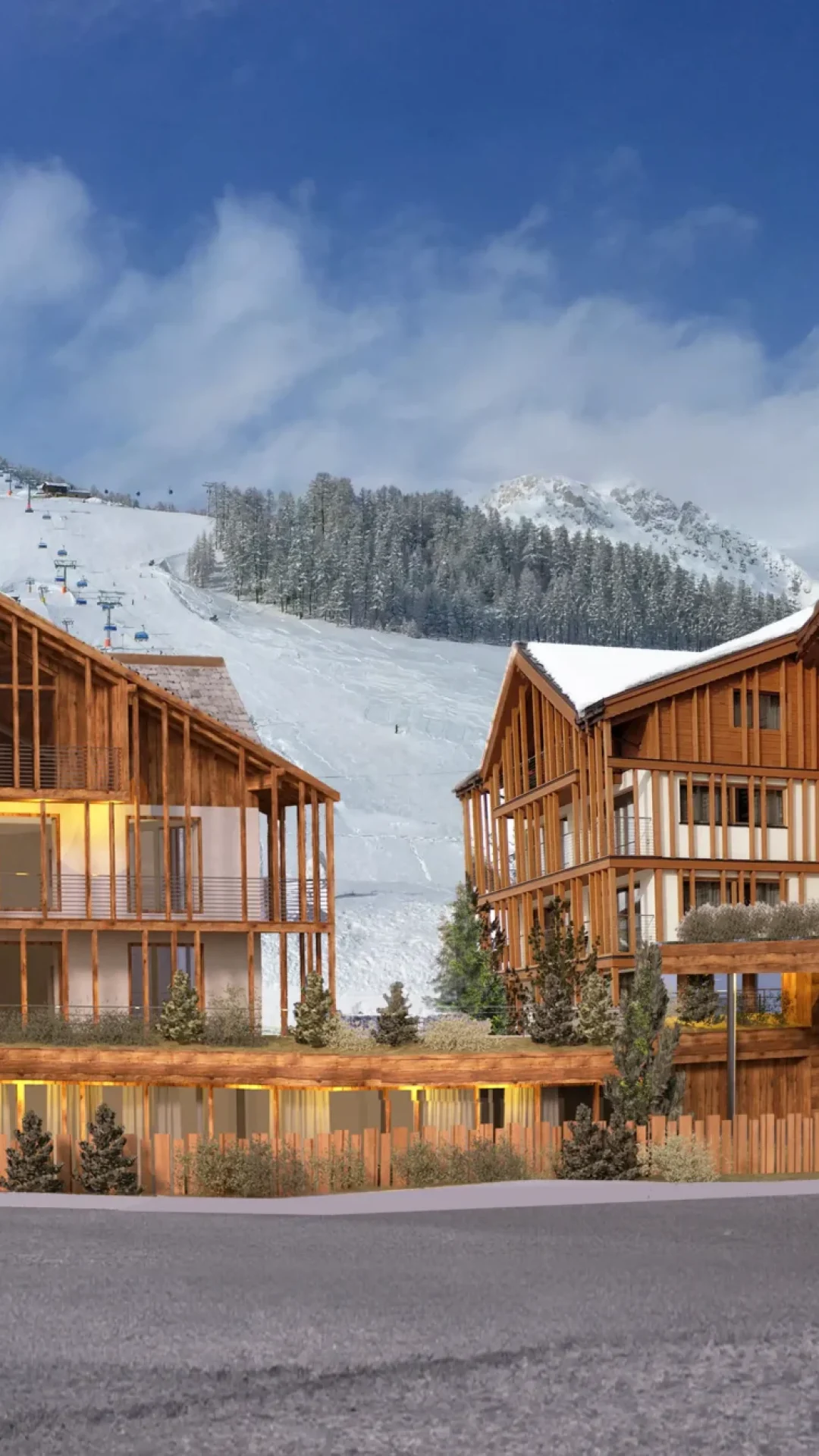 Complesso alberghiero in legno ai piedi di una montagna innevata.